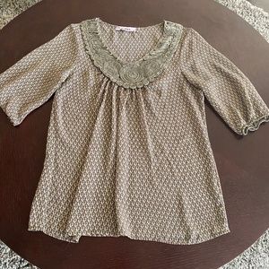 Rosebud 3/4 sleeve top with embellished neckline